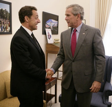 President George W. Bush drops by a meeting between National Security Advisor Stephen Hadley and France's Minister of the Interior and Regional Development Nicolas Sarkozy at the White House.  http://www.whitehouse.gov/news/releases/2006/09/images/20060912_p091206kh-0132-515h.html.  Tuesday, Sept. 12, 2006.  White House photo by Kimberlee Hewitt.  This work is in the public domain in the United States because it is a work of the United States Federal Government under the terms of Title 17, Chapter 1, Section 105 of the US Code. See Copyright.